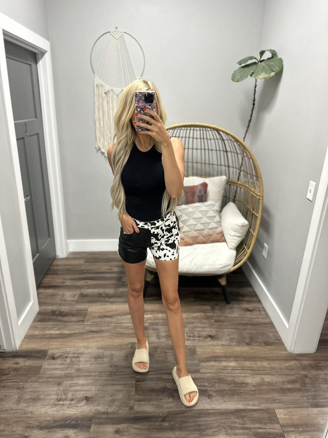 KIARA COW PRINT BLACK LEATHER SHORTS